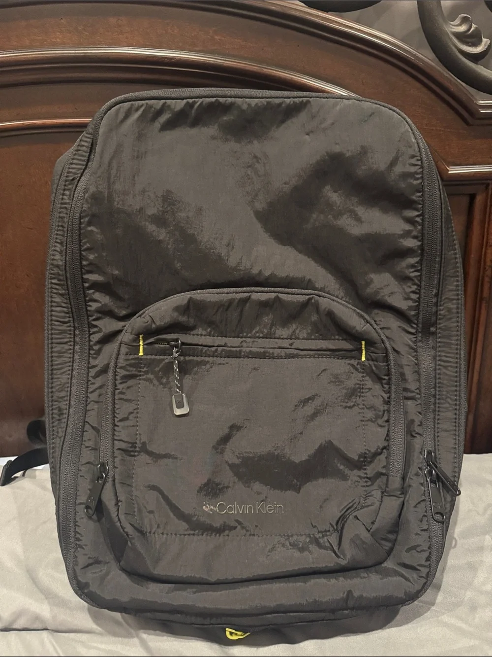 Calvin Klein Men's Black Backpack with Subtle Yellow Accents